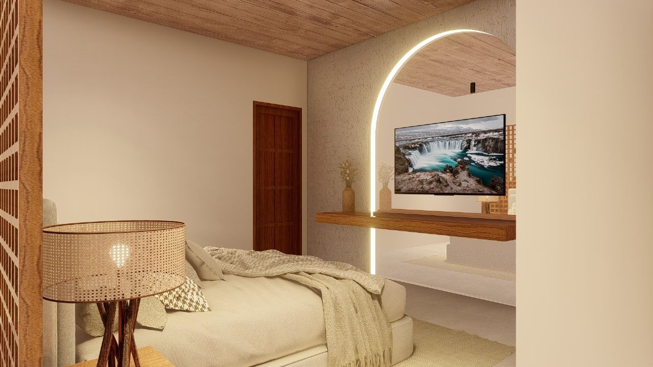 Um quarto com uma cama, abajur e televisão.