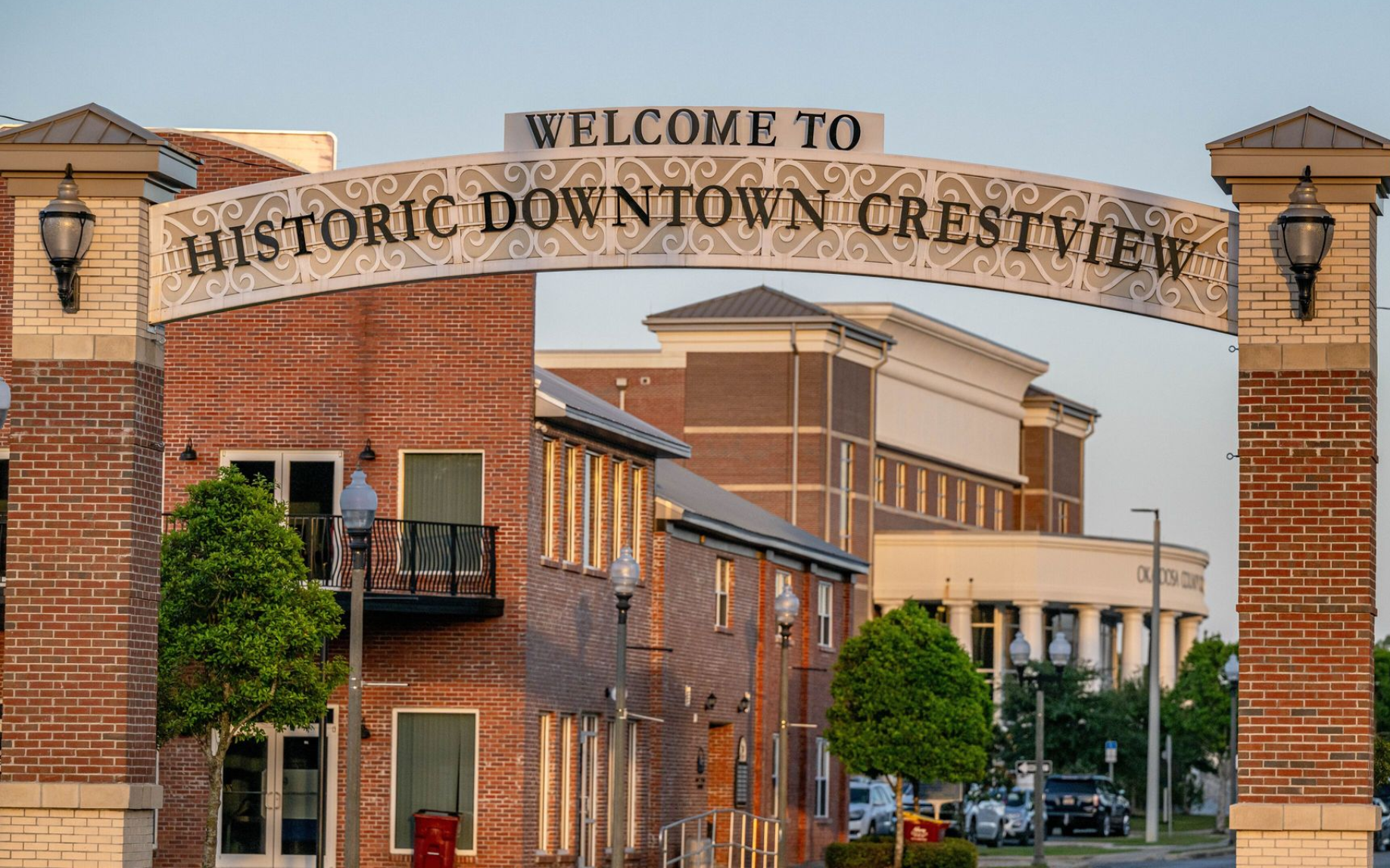 A decorative archway over a street reads
