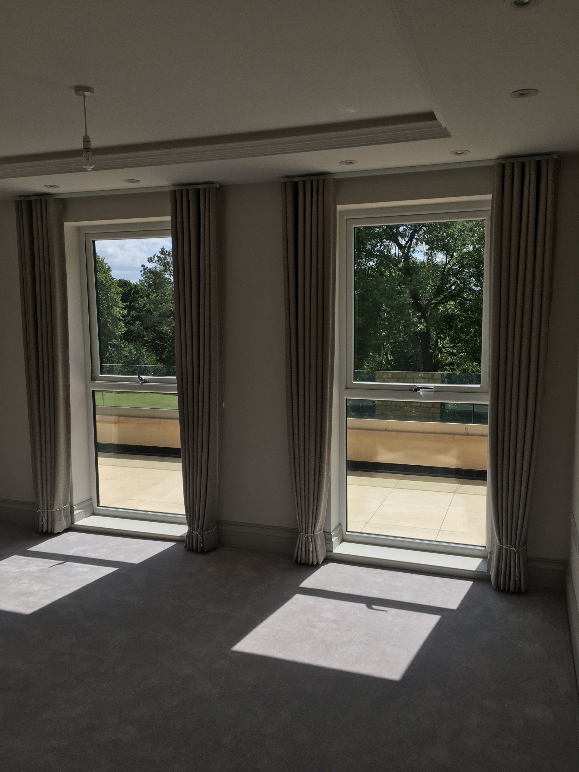 woman install curtains