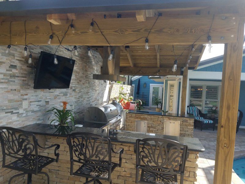Outdoor Kitchen with Television — Clermont, FL — Florida Dock & Boat Lifts