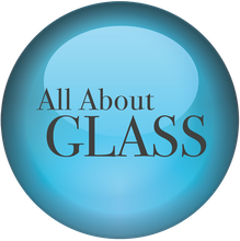 A blue button that says all about glass on it