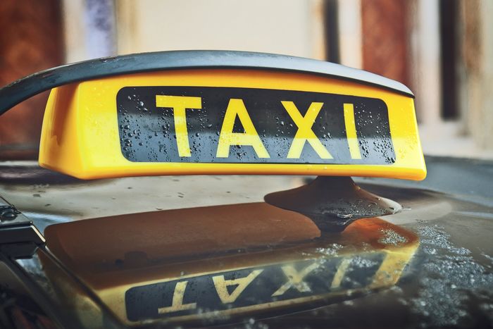 Close up of taxi sign on car roof