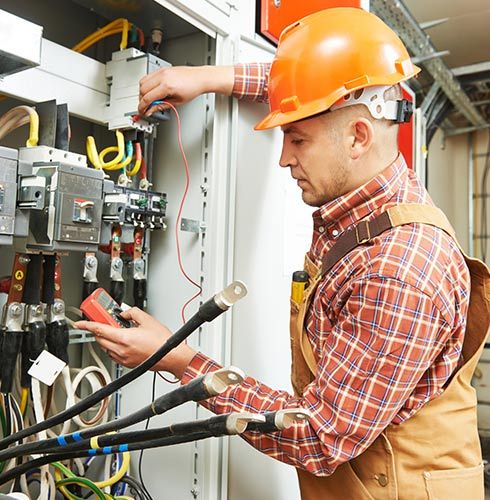 Electrician Repairing Breaking Panel — Residential Electrical Services in Saint Paul, MN Electrician Repairing Breaking Panel — Residential Electrical Services in Saint Paul, MN