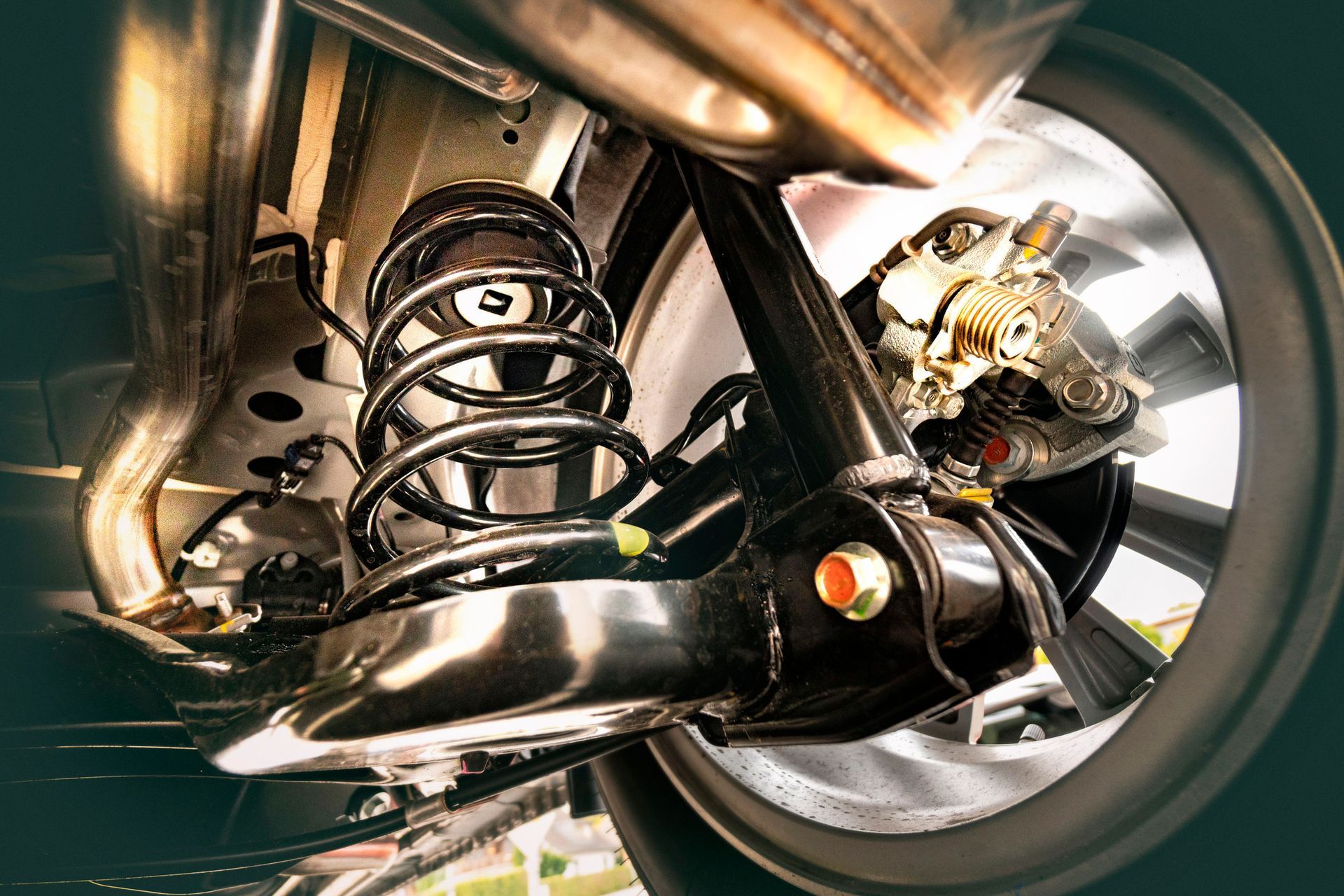 A close up of the rear suspension of a car.