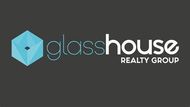 A blue realtor logo on a white background