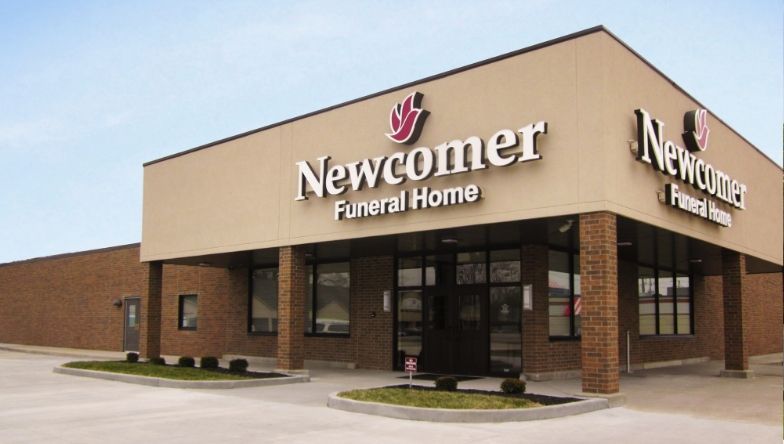 A newcomer funeral home is located in a brick building