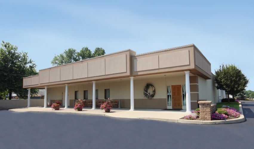 A large building with a wreath on the door