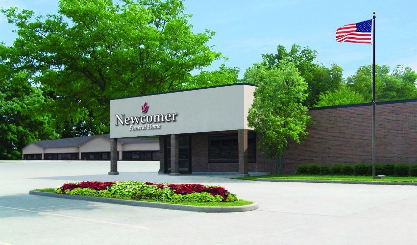 A large building with a flag in front of it