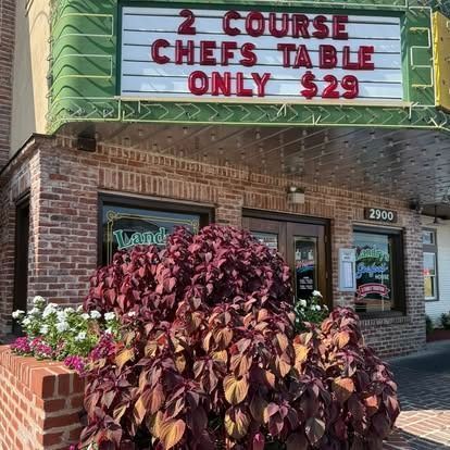 Restaurant exterior with sign: