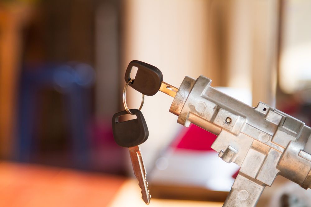 A Close Up Of A Car Key Lock With Two Keys Sticking Out Of It — Port Macquarie Locksmiths In Port Macquarie, NSW