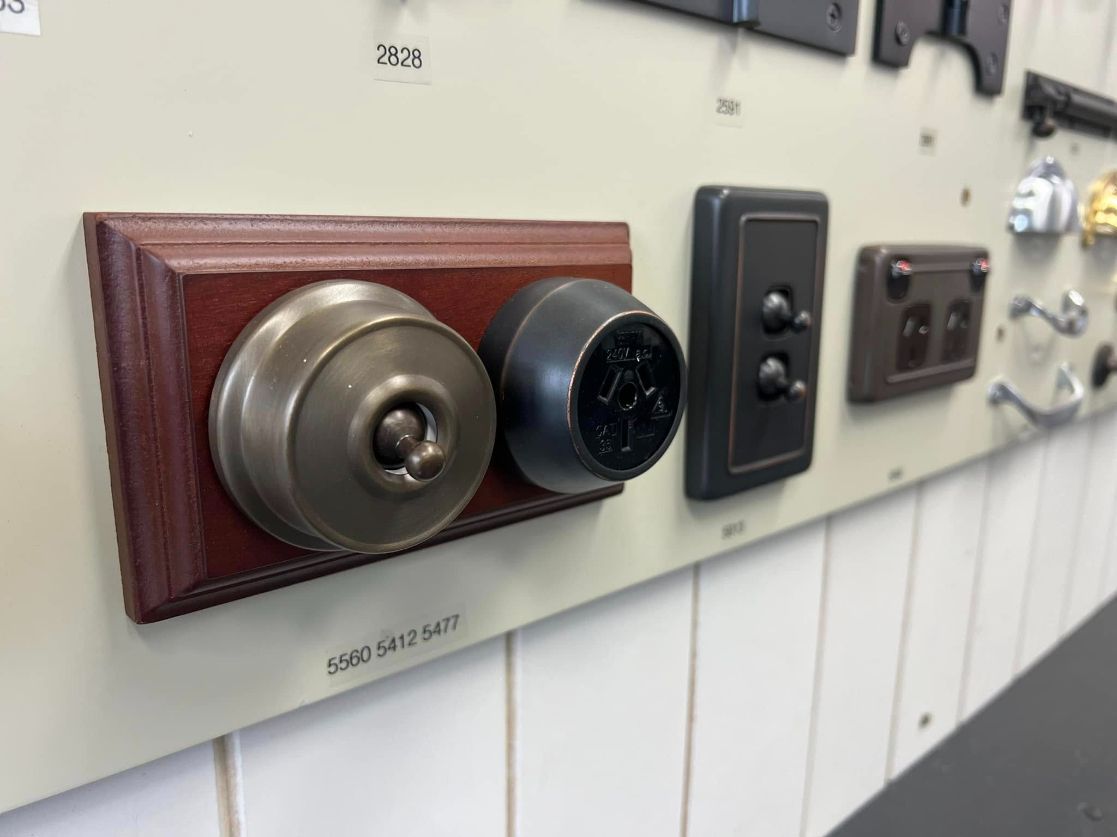 A Car Key Is Sitting On A Wooden Table — Port Macquarie Locksmiths In Kempsey, NSW