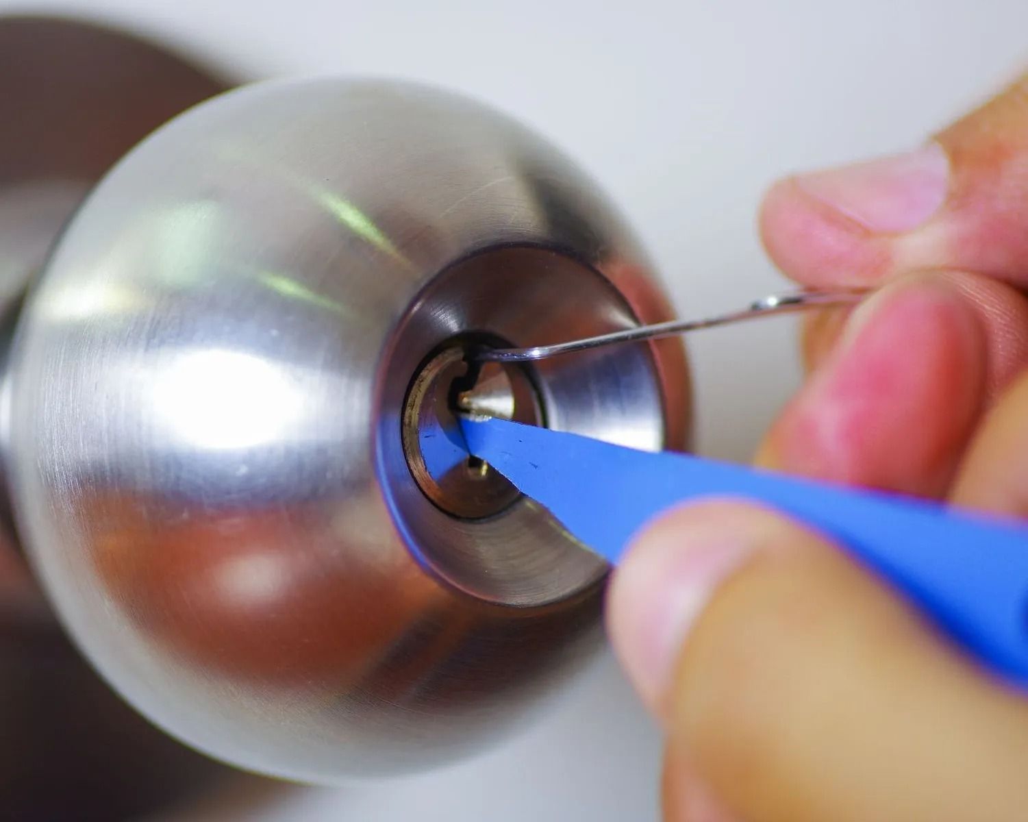 Locksmith Picking a Door Knob