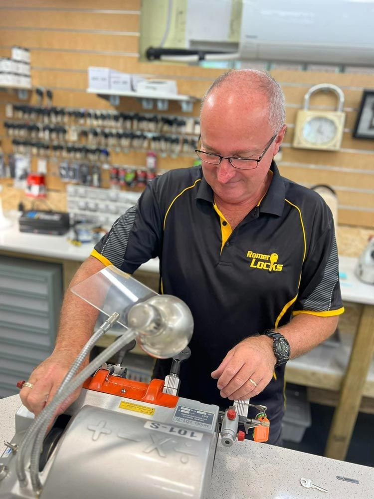 Locksmith Working On The Machine