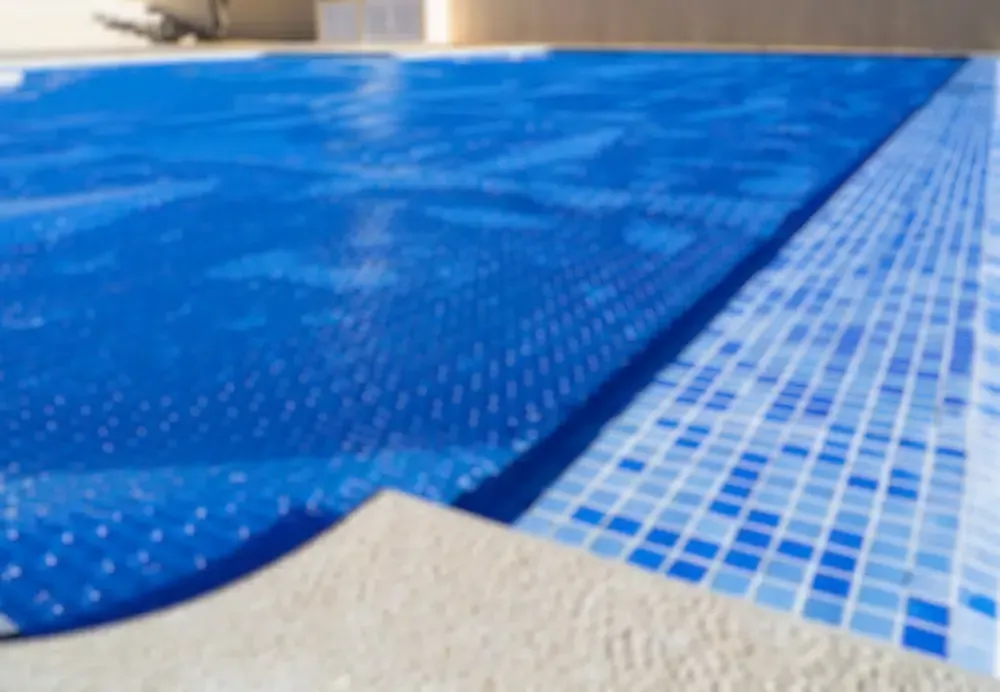 A Swimming Pool With A Blue Cover On It — Aussie UnderCover In South Nowra, NSW