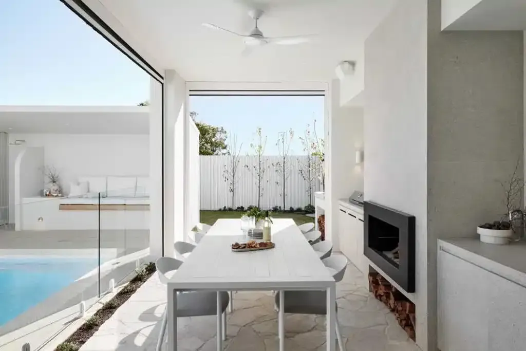 A Dining Room With A Table And Chairs And A Fireplace — Aussie UnderCover In South Nowra, NSW