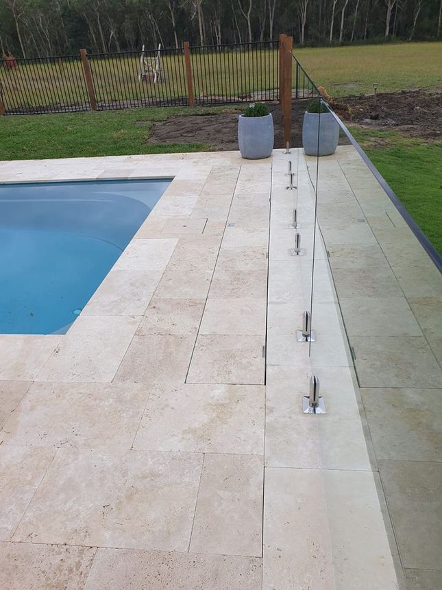 A Large Swimming Pool Surrounded by Grass and Trees — Aussie UnderCover In South Nowra, NSW