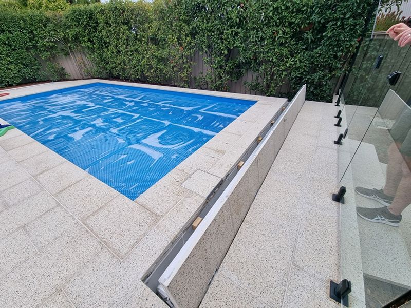 A Person Is Standing Next To A Large Swimming Pool — Aussie UnderCover In Fremantle, WA