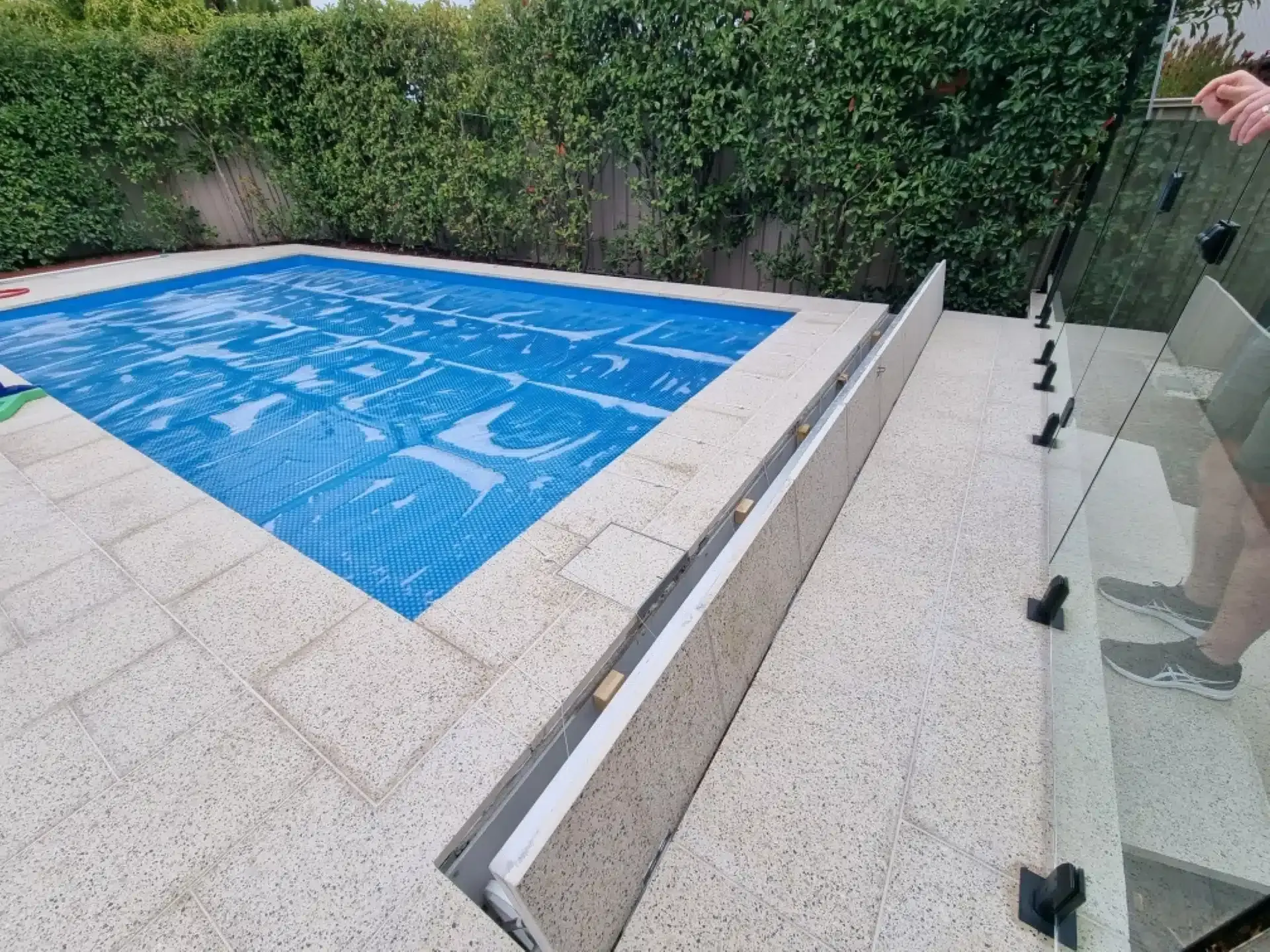 A Swimming Pool With A Glass Fence — Aussie UnderCover In South Nowra, NSW