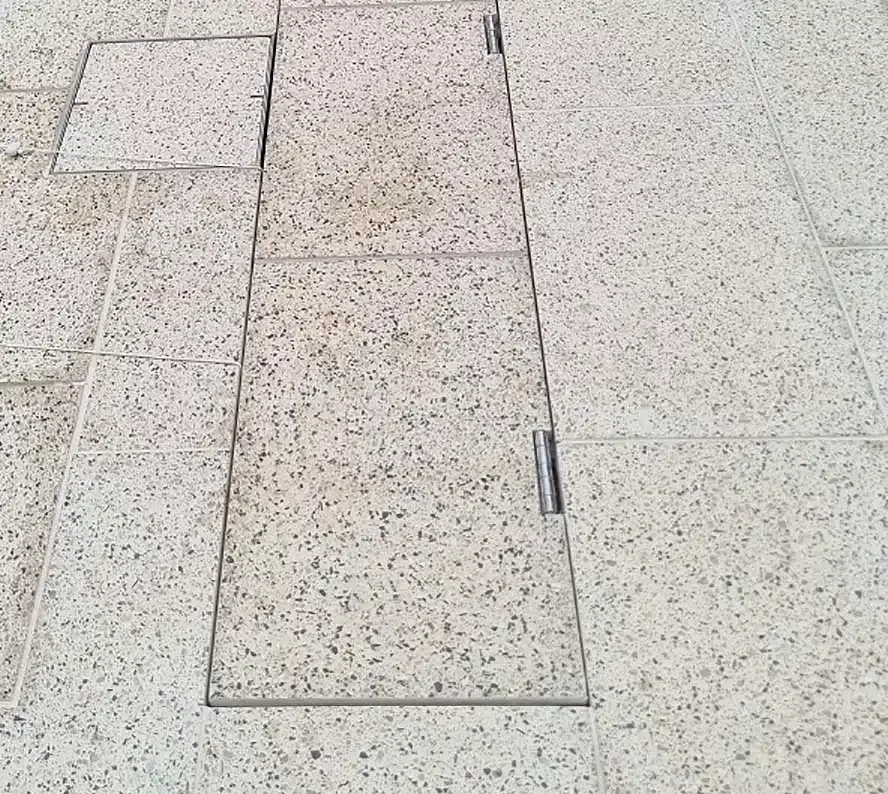 A Manhole Cover Is Sitting On Top Of A Tiled Floor — Aussie UnderCover In South Nowra, NSW