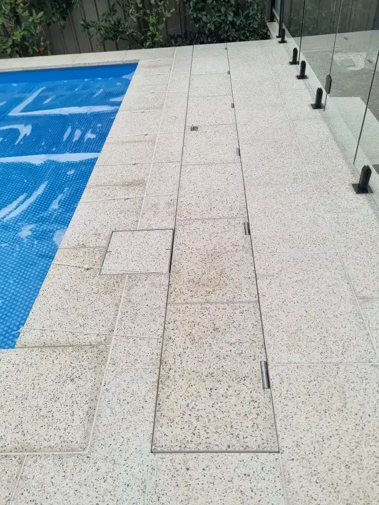 A Swimming Pool With A Drain On The Side Of It — Aussie UnderCover In South Nowra, NSW