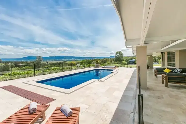 There Is A Large Swimming Pool In The Backyard Of A House — Aussie UnderCover In South Nowra, NSW
