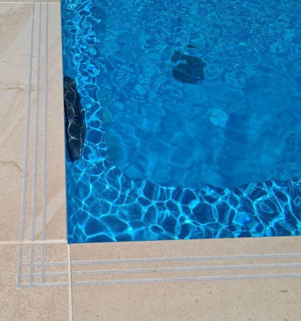 A Close Up of a Swimming Pool With Blue Water — Aussie UnderCover In South Nowra, NSW