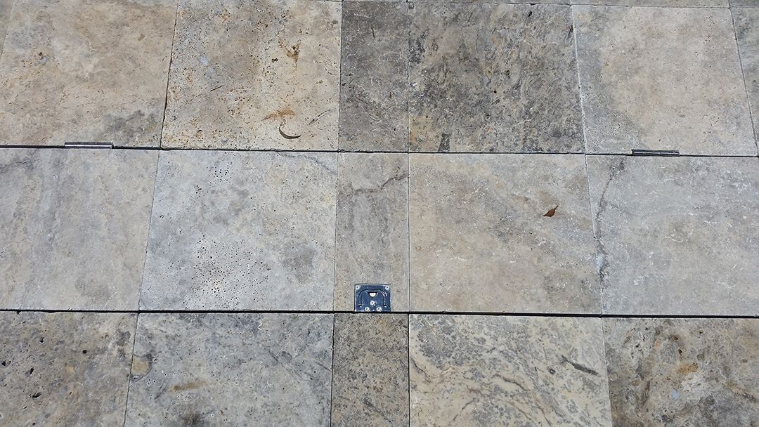 A Close Up Of A Tiled Floor With A Blue Square In The Middle — Aussie UnderCover In Brisbane, QLD