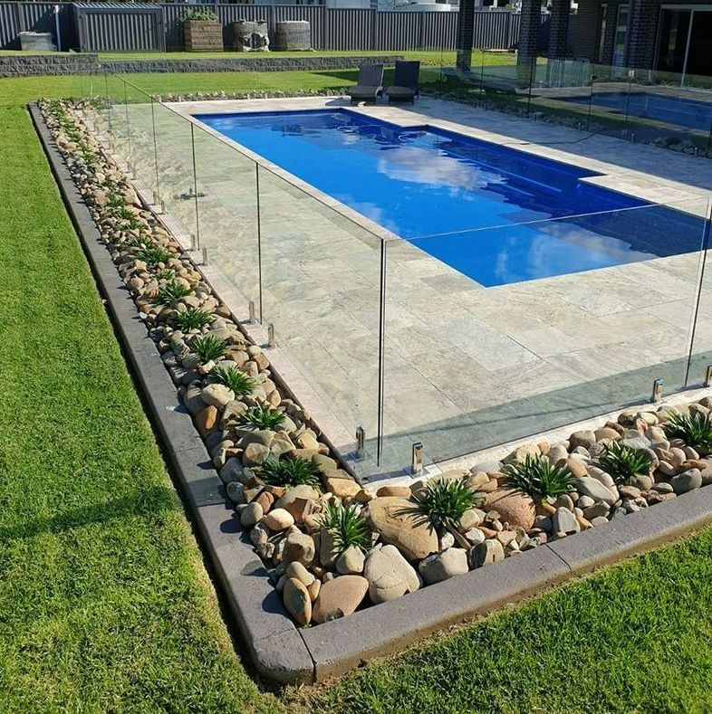 A Large Swimming Pool With A Glass Fence Around It — Aussie UnderCover In South Nowra, NSW