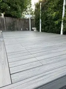 A Gray Wooden Deck With A Fence In The Background — Aussie UnderCover In South Nowra, NSW