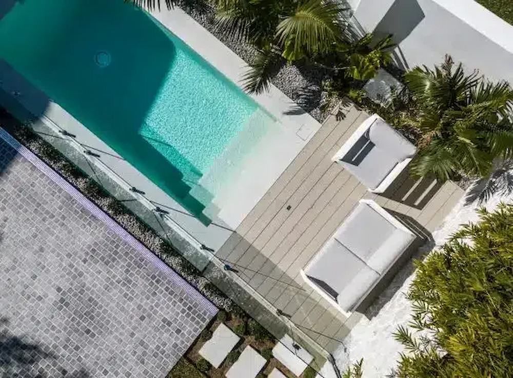 An Aerial View of a Swimming Pool Surrounded by Palm Trees — Aussie UnderCover In South Nowra, NSW
