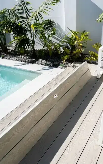 A Swimming Pool Is Surrounded By Trees And A Wooden Deck — Aussie UnderCover In South Nowra, NSW