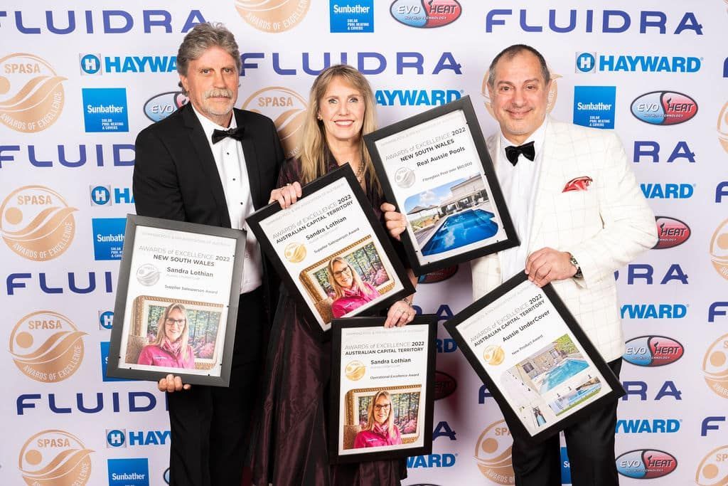 A Group Of People Holding Awards In Front Of A Wall That Says — Aussie UnderCover In South Nowra, NSW