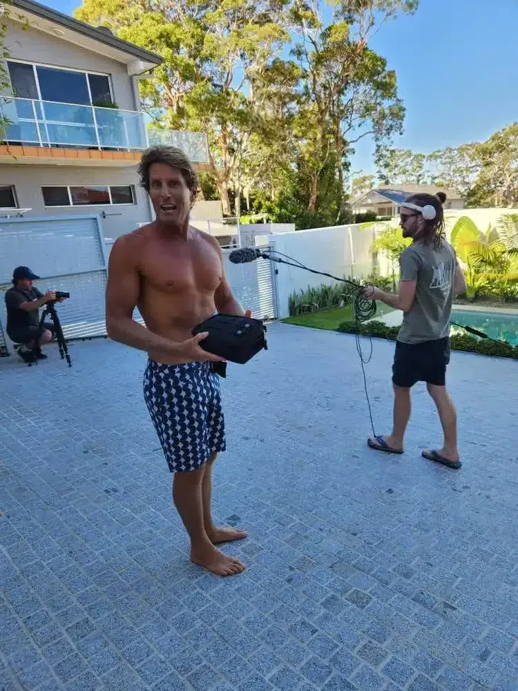 A Man Without A Shirt Is Standing Next To Another Man On A Leash — Aussie UnderCover In South Nowra, NSW