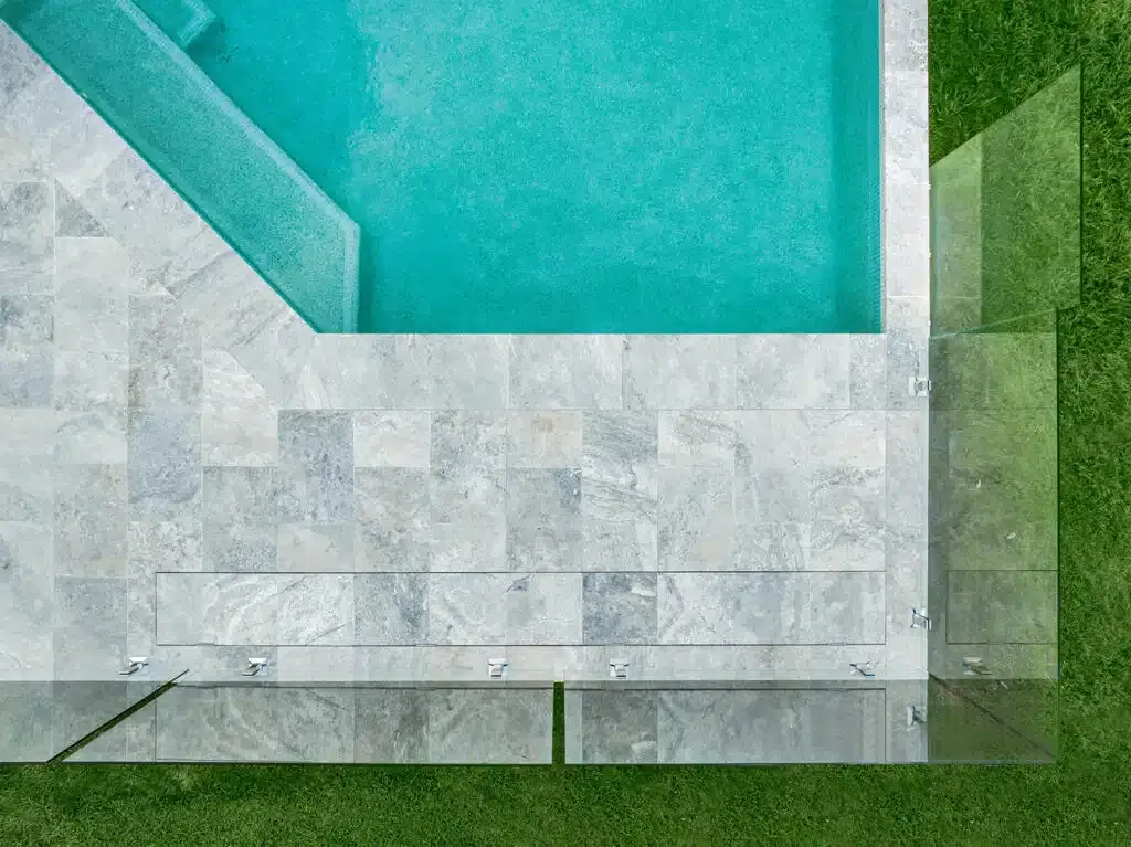 An Aerial View Of A Swimming Pool Surrounded By Tiles And Grass — Aussie UnderCover In South Nowra, NSW