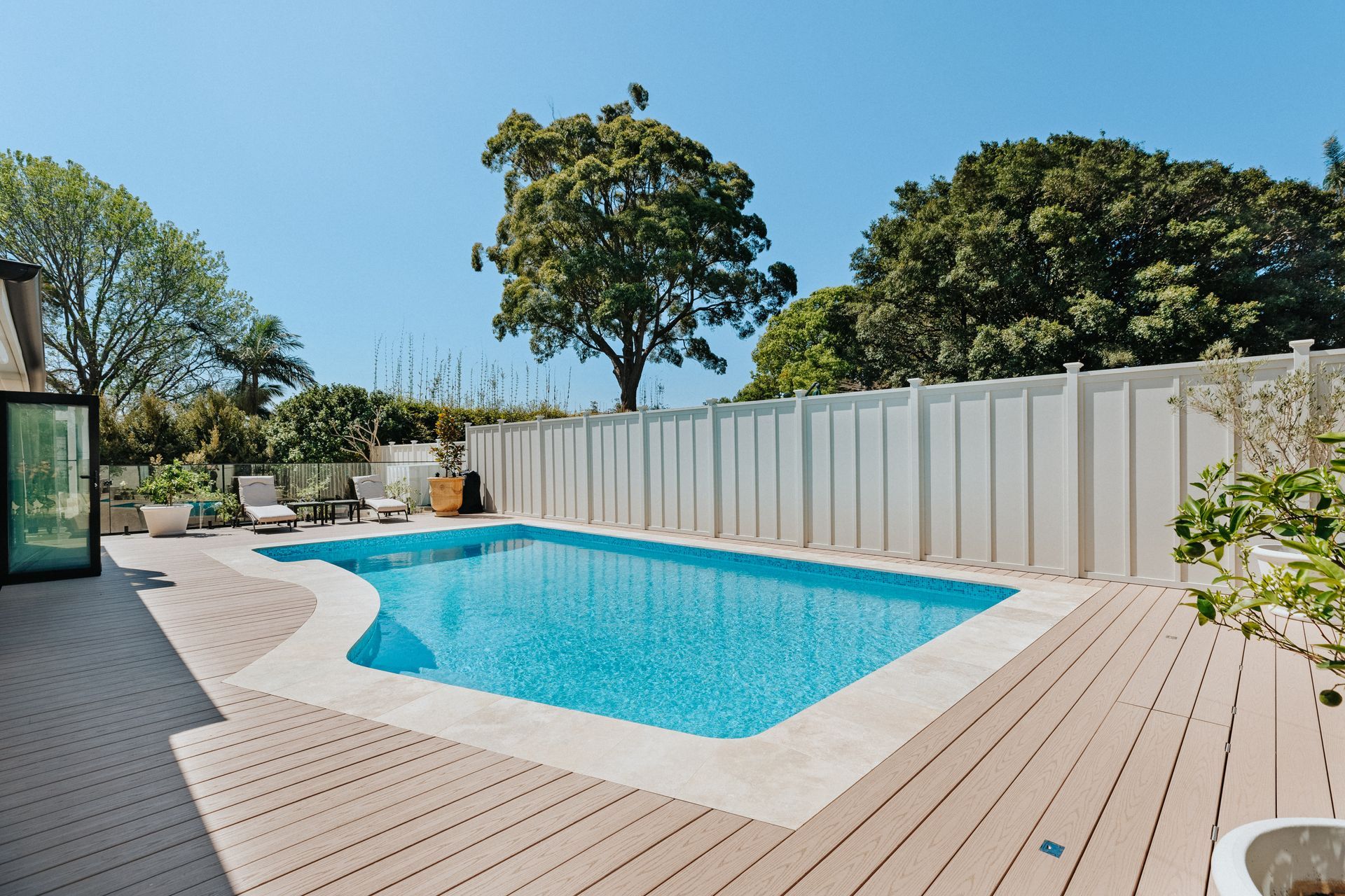There Is A Large Swimming Pool In The Backyard Of A House — Aussie UnderCover In South Nowra, NSW