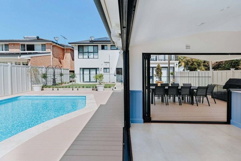 A House With a Swimming Pool and a Dining Table and Chairs — Aussie UnderCover In South Nowra, NSW