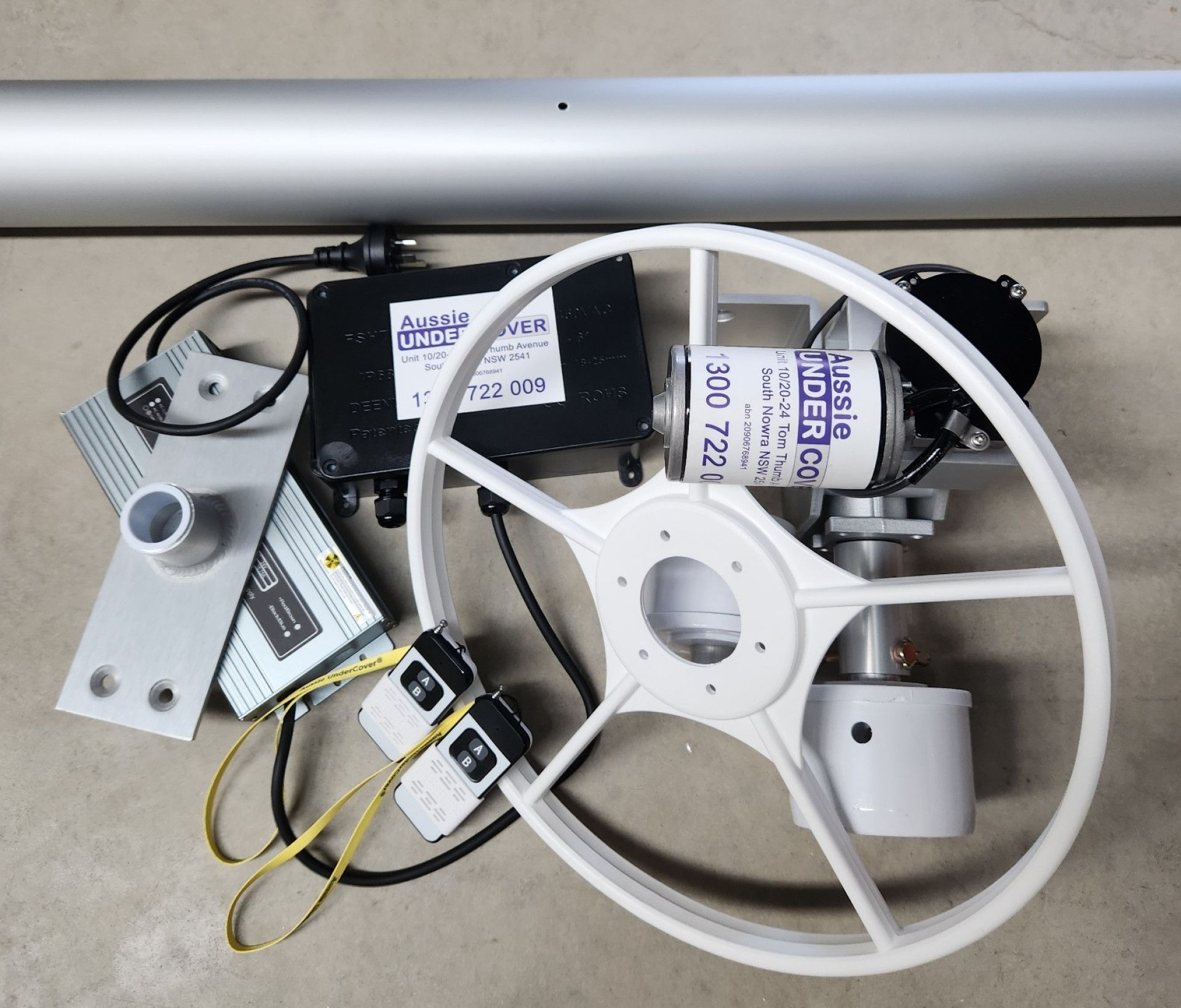 A White Steering Wheel Sits Next to a Motor — Aussie UnderCover In South Nowra, NSW