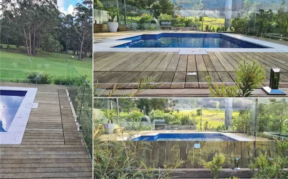 A Swimming Pool With A Wooden Deck And A Glass Fence — Aussie UnderCover In South Nowra, NSW