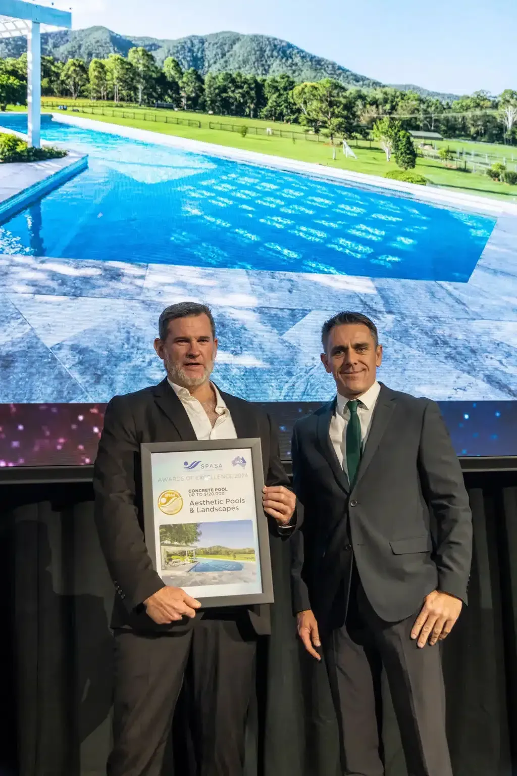 Two Men In Suits Are Standing Next To Each Other Holding A Certificate — Aussie UnderCover In South Nowra, NSW