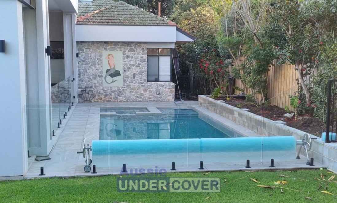 A Large Swimming Pool Is Sitting In The Backyard Of A House — Aussie UnderCover In South Nowra, NSW