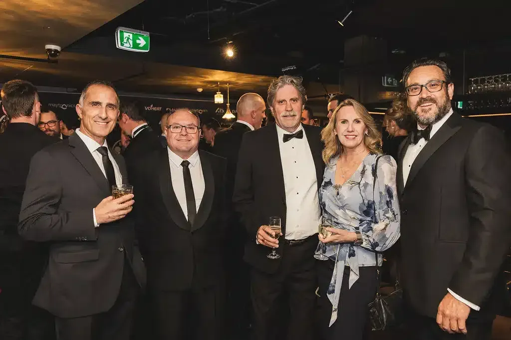 A Group Of People In Tuxedos Are Posing For A Picture At A Party — Aussie UnderCover In South Nowra, NSW
