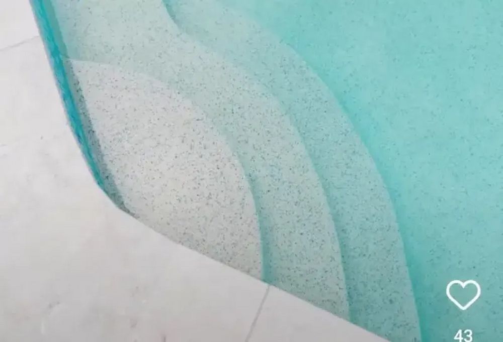 A Close Up of a Swimming Pool With Blue Water and White Steps — Aussie UnderCover In South Nowra, NSW
