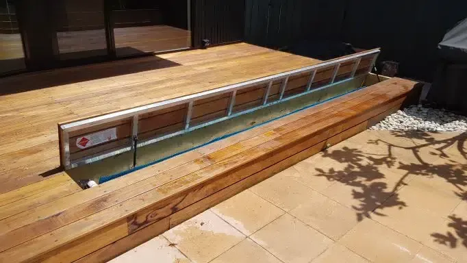 A Wooden Deck With A Metal Railing On The Side Of It — Aussie UnderCover In South Nowra, NSW