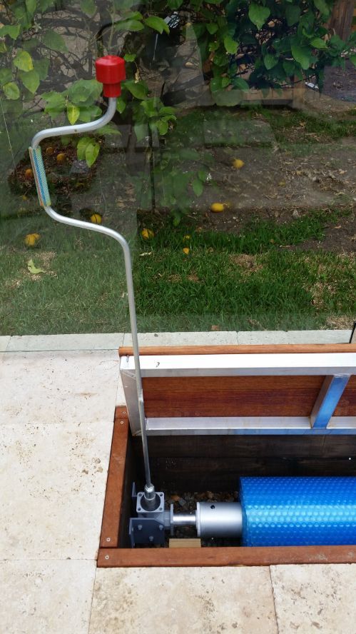 A Swimming Pool Cover is Being Installed in a Hole in the Ground — Aussie UnderCover In South Nowra, NSW