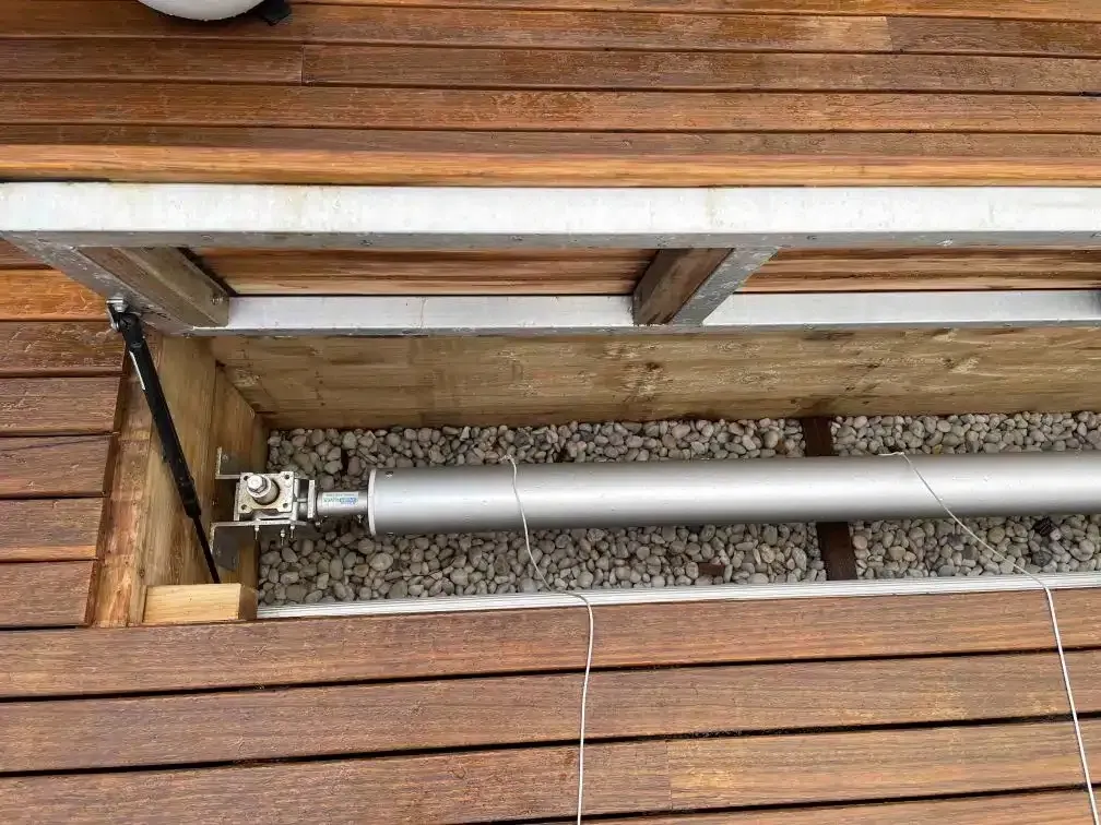 A Metal Pipe Is Sitting On Top Of A Wooden Deck — Aussie UnderCover In South Nowra, NSW