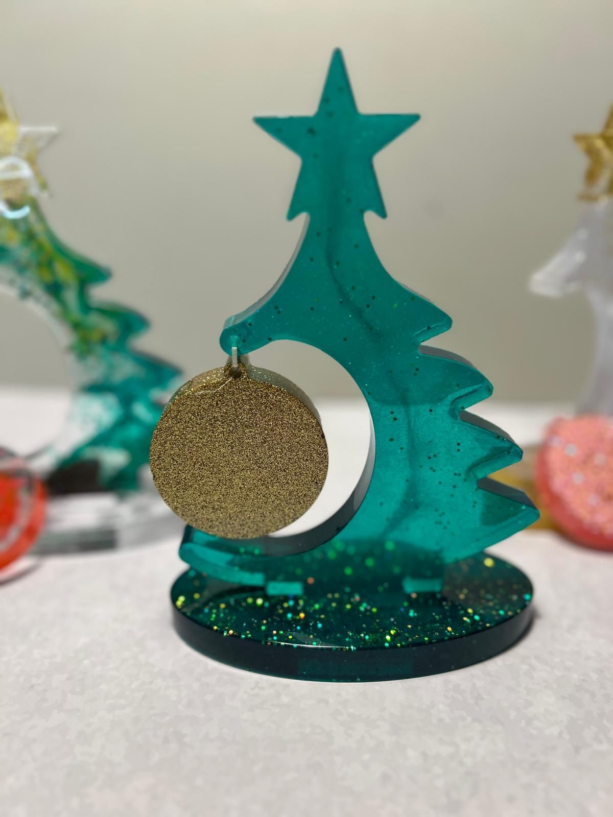 A green christmas tree with a star and a gold ornament for Dragonfly crafts party