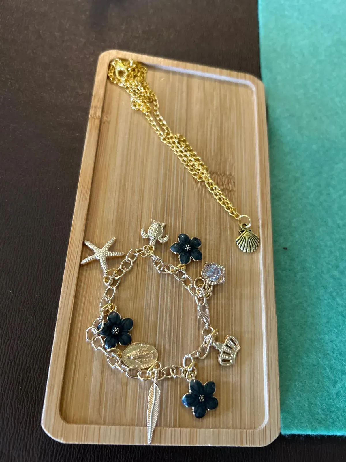 A group of women are sitting at a table in a room for charm party at Dragonfly crafts parties