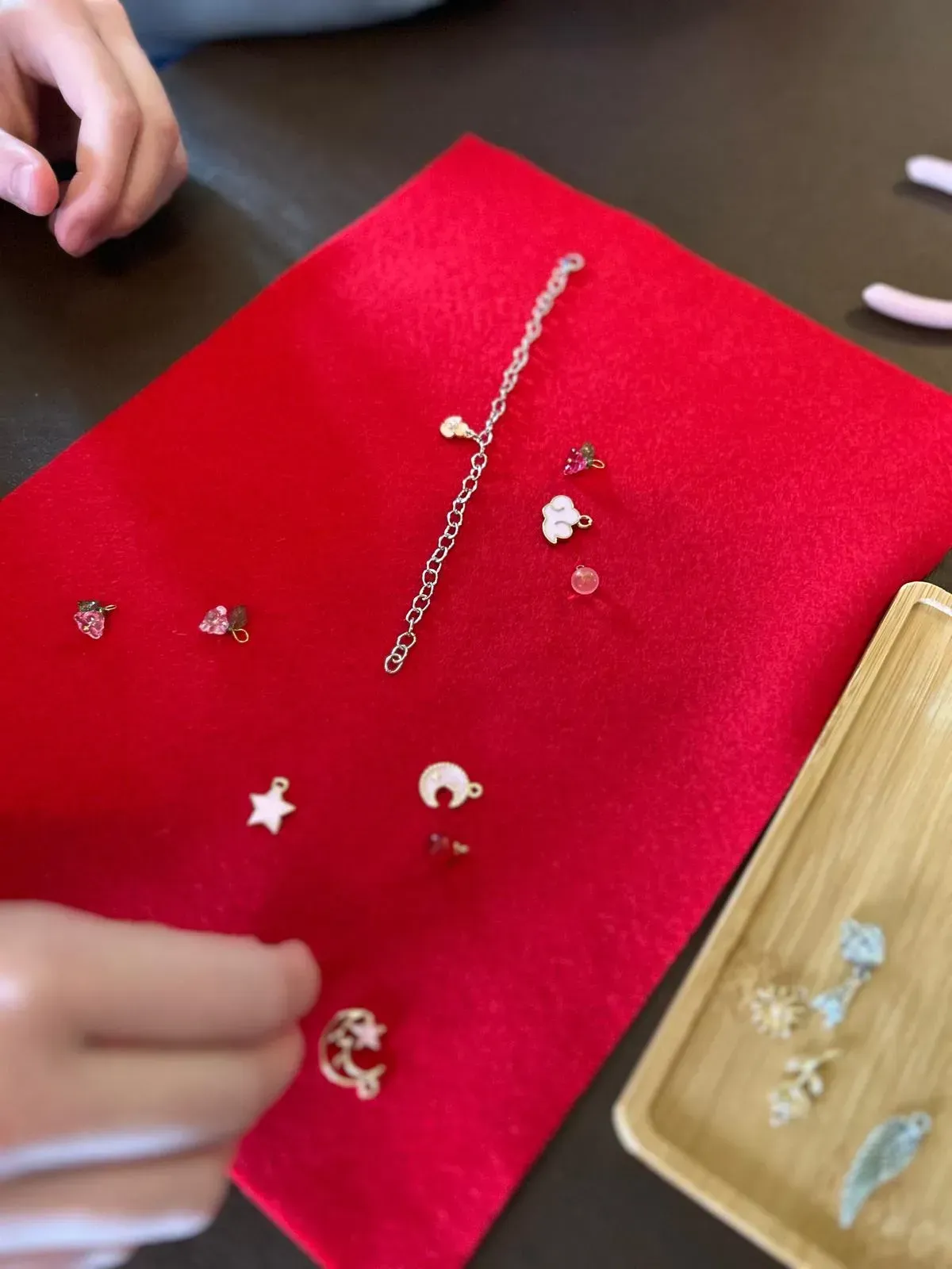 A group of people wearing bracelets on their wrists, for charm party  at Dragonfly crafts parties