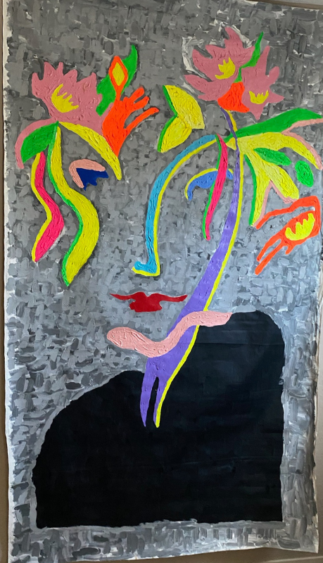 A painting of a woman 's face with flowers coming out of it