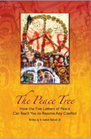 A book titled the peace tree has a peace sign on the cover